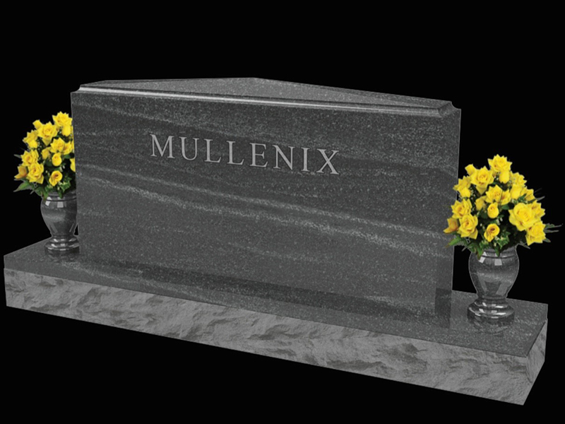 Monument-Mullenix black granite monument rectangle with flowers on each end.