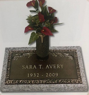 Bronze Marker - Avery bronze memorial with flowers