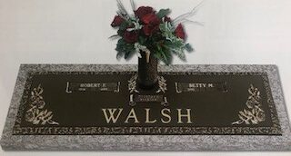 Bronze Marker - Walsh bronze memorial with flowers